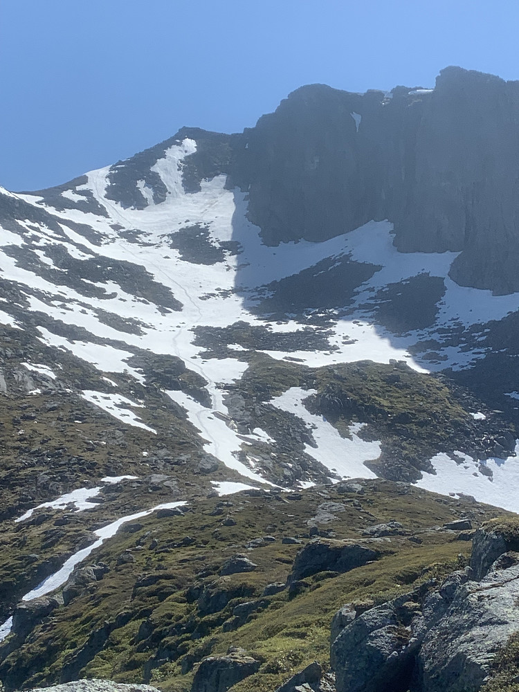 Looking back at the snow fields we slid down 