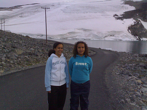 Image 2: My daughters in front of lake ''Juvvatnet'' and the glacier ''Juvassbreen''. The ski lift of ''Galdhøpiggen Summer Ski Center'' is seen on the glacier. We were 3 days at this place, one day trekking Mount Galdhøpiggen, and then two days skiing on the glacier.