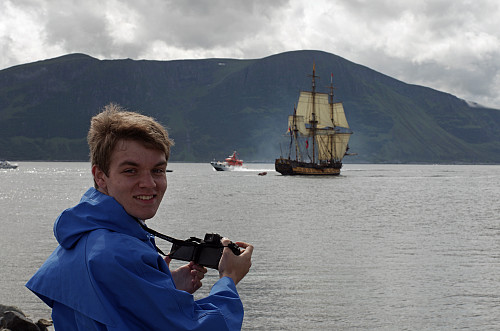My cousin Alexander on the breakwater of Hogstein Lighthouse on Godøy Island, watching the ships of Tall Ships Races of 2015 passing by as they were leaving the town of Ålesund. We had planned to watch the event from the peak of Mount Storehornet, the highest peak of the Island; but headed for the Hogstein breakwater instead, as we realised the summit of the mountain was shrouded in clouds.