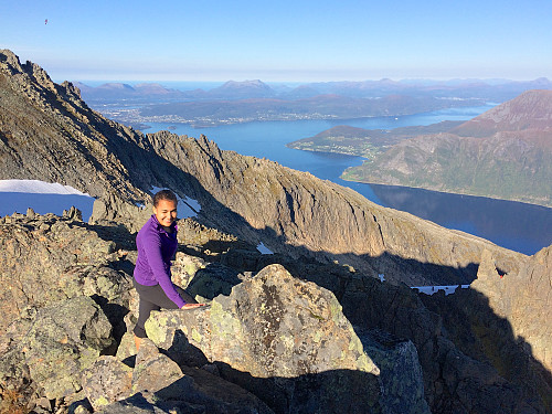 #3: Making our way towards Mohn's Peak. The ridge in the background leads up to Rander's Peak, part of which is seen in the upper left corner of the image. Behind the ridge part of the town of Ålesund may be spotted.