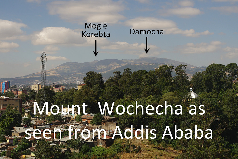 #23: It is possible to spot the highest Wochecha summits all the way from Addis Ababa. Moglē Korebta (3324 m.a.s.l.) and Damocha (3391 m.a.s.l.) are pointed out with arrows. Wochecha is the name of the entire mountain.