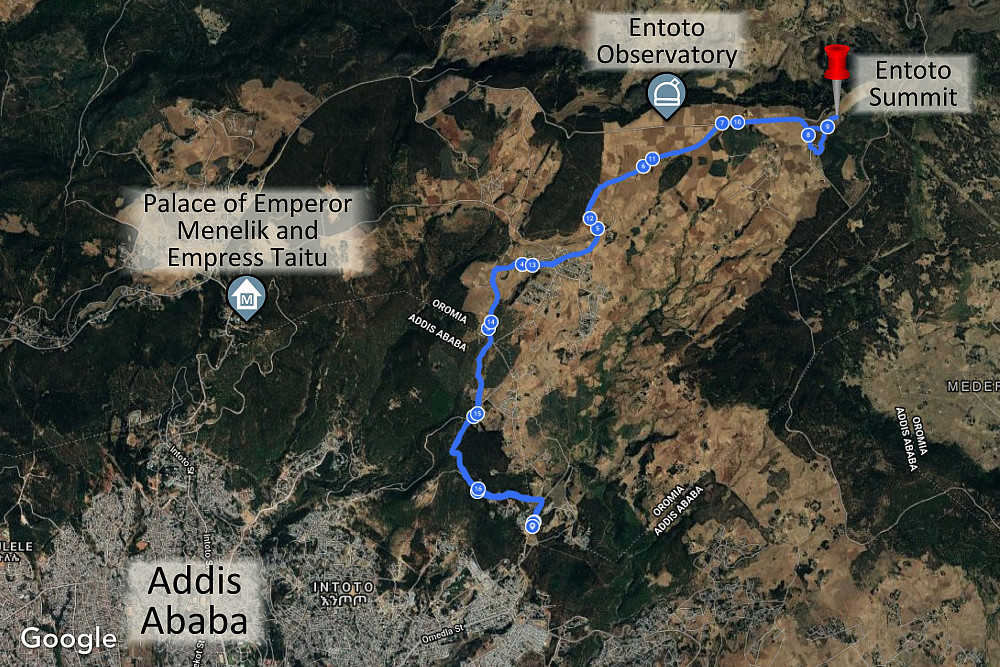 #10: Google Maps satellite image showing the location of the Entoto summit relative to the Entoto Observatory and to the old palace of Emperor Menelik 2nd. The image demonstrates that if you've just been to the old palace, you've not even been close to the summit of the mountain; the summit is located far more east. The blue line is the GPS tracking of our trek.