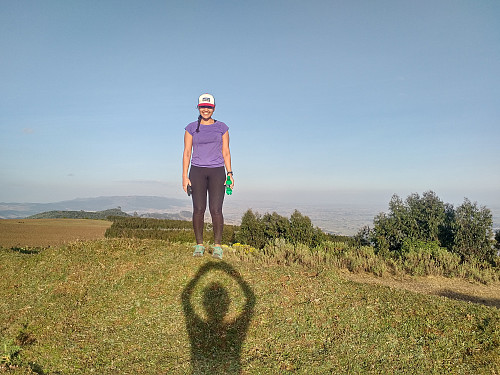 #18: My daughter at what seemed to be the highest point in the vicinity of the building on the previous photo. The sun was quite low in the sky at this point of time, hence my shadow has also been captured. It's the only image I have of one of us at the summit, however, so I'm uploading the image, even though I'm aware that in photographic circles it is considered a "sin unto death" to have your own shadow in a photo.