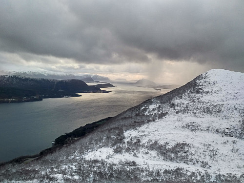 View from the Southwest edge of Mount Storhornet towards the fjord called Grytafjorden. The mountain in the right part of the picture is Mount Litlehornet [i.e. "The Little Horn"].