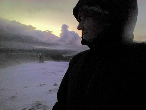 On the summit of Mount Storhornet. It was quite windy up there, and snow from the mountainside beneath was blowing right into our faces.