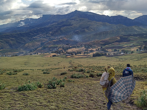 #59: Mount Bwahit with the village of Arkwasiye visible beneath it. Our temporary guide from Menta Ber is the guy with the umbrella, and Enyew the one in front of him.