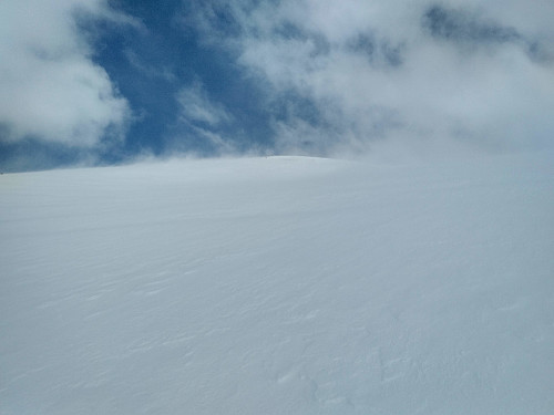 #14: As I was approaching the summit of Mount Smørbottind the weather was improving, however, and even some blue sky could be seen.