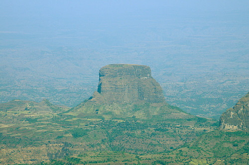 #4: The Hawaza mountain as seen through a telephoto lens from the Chennek Viewpoint. This mountain is composed of lava that once upon a time solidified inside the crater of a volcano. With time the rest of the mountain eroded away, and today only the central lava core remains.