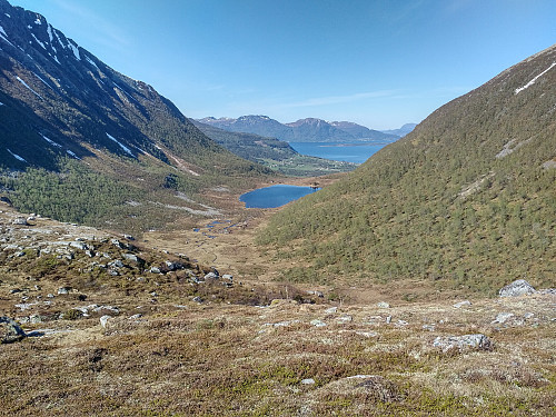 #4: Melskaret valley between Mount Melen (to the left) and Mount Oterfjellet (to the right). Lake Melskarsvatnet, the village Fiksdal, and the fjord Romsdalsfjorden are seen in the background.
