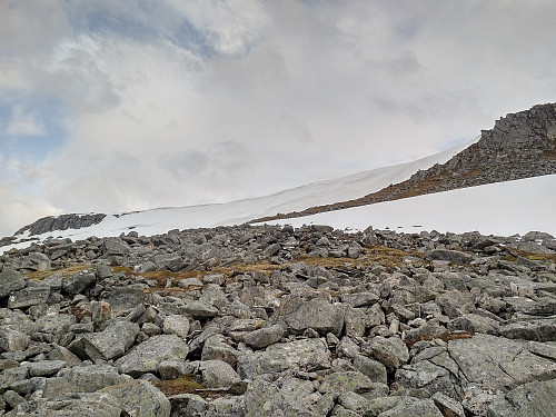 #25: As I was descending into the valley of Eikedalen, there were still some snow shelves that one needs to look out for, and avoid walking beneath them. As summer is approaching, this one's probably going to melt down to nothing right where it is; but you can't rely on it, as a piece of it may occasionally break off, even at this time of the year.