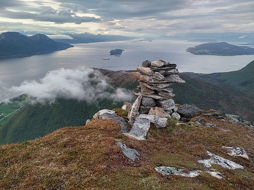 #32: On the viewpoint of Hestenebba. The island in the middle of the fjord is Tautra. The town of Molde is located on the mainland beyond it.