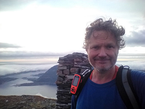 #33: On top of Mount Rekdalshesten. The strait of Misund, located between the islands Otrøya and Midøya, is seen in the background.