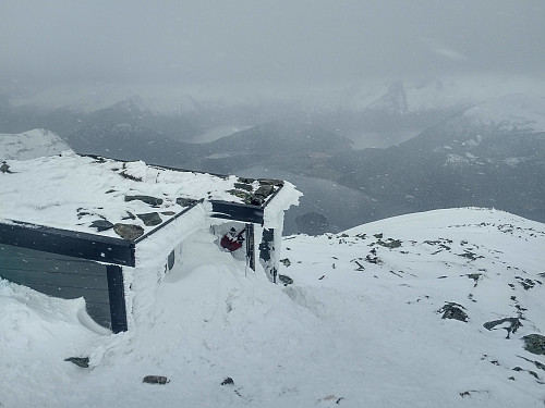 #8: The entrance to the cabin was completely covered by heavy snow that had been blown up towards the door.