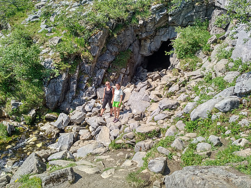 Image #5: My sister and my daughter in front of the entrance to the first, or lowermost cave. The river exits the cave though this entrance, and is actually running beneath and in between the stones on which my sister and daughter are standing.
