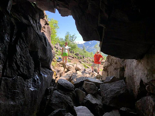 Image #6: My daughter and I standing outside the first cave. There are huge stones covering the floor of the first few meters of the cave, but there's no difficult climbing involved in getting past them.