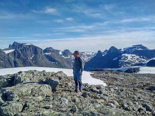Image #16: On the very summit of the Mountain. In the background Mount Store Trolltinden [Greater Troll Peak] is seen to the left, while the Bishop, the King, and Mount finnan is seen to the right.