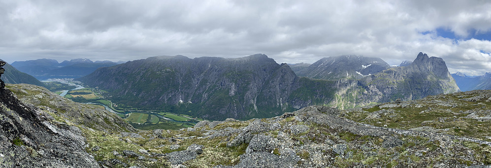 Image #9: The view from Mount Norafjellet towards the mountain range of Romsdalsegga. In the right end of the mountain range is seen Mount Romsdalshornet, Mount Lillehornet, and Mount Nesaksla. The mountain reaching into the clouds is Mount Store Venjetinden.