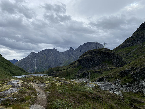 Image #8: Svartebotnen Valley with Lake Svartebotsvatnet. Since this valley forms a notch in a long 8-mountain, it has been used as a passageway for the high voltage lines going from Åndalsnes westward on the south side of the fjord called Romsdalsfjorden.