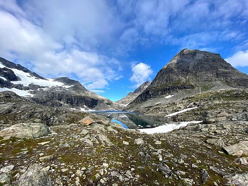 Image #4: Lake Bispevatnet [i.e. "The Bishop's Lake"] with its beautiful blue water. Mount Bispen is seen to the right, and Mount Finnan to the left. Mount Kongen [i.e. "The King"] is partially hidden behind "The Bishop".