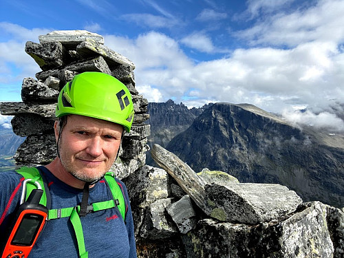 Image #8: On the summit of The Bishop. The Troll Peaks, which line the top of the famous Troll Wall [Norwegian: "Trollveggen"] are seen in the background.