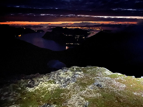 Image #41: From The “Beerman’s Peak”. The lights of the town of Molde is seen in the far distance, and the fjord Romsdalsfjorden with some islands and peninsulas may be discerned in front of it.