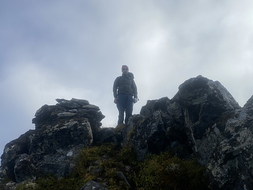 Image #9: My son on the summit of Mount Klovetinden, or Mount Masdalskloven, which it is also called. The mountain is usually climbed up the sloping east side, as the other sides are quite steep.
