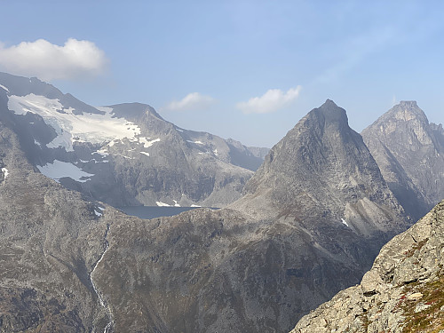 Image #2: View from Mount Stigbotthornet towards Mount Bispen, Lake Bispevatnet, Mount Kongen, and Mount Finnan. In the mountain side of Mount Finnan there's a glacier. Mount Dronninga is partially visible behind Mount Kongen.