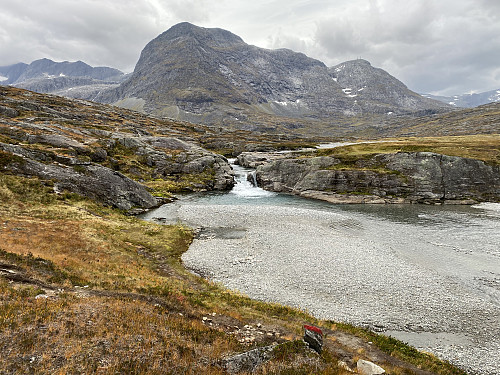 Image #10: A view of the upper part of the river Istra, as it is running from Lake Alnesvatnet towards Trollstigen Tourist Center. The mountain in the background is called Skarfjellenden.