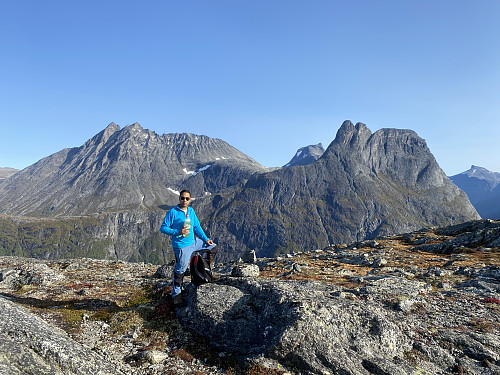 Image #3: On top of Mount Norafjellet. In the background are seen the peaks of Store Venjetind and Lille Venjetind to the left, Mount Kalskråtinden in the middle; and Mount Romsdalshornet, Mount Lillehornet, and Mount Hornaksla to the right.