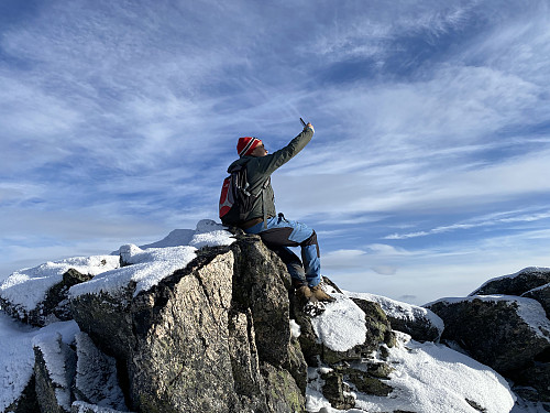 Image #11: On top of Mount Breitinden, capturing pictures and videos with a cellphone.