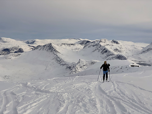 Image #20: Approaching the summit of Mount Alnestinden. The mountain ridge seen immediately behind my son is the east ridge of the mountain. The mountain further back, is Mount Skarfjellet, and the valley in the left part of the picture is Alnesdalen Valley. The summit of Mount Alnestinden is located at 1665 m.a.m.s.l.