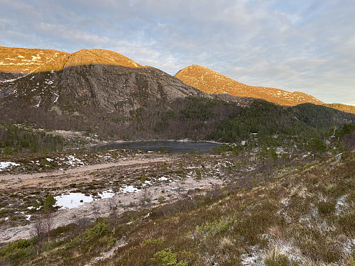Image #6: Lake Heggdalsvatnet as seen from a little further up the trail towards Mount Heggdalshornet ant Mount Opstadhornet. The mountains in the background are Mount Manfjellet and Mount Myrsethornet, I believe. The shadow in the mountainside is that of Mount Heggdalshornet and Mount Opstadhornet.