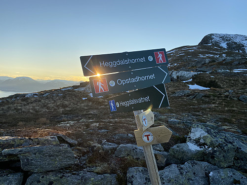 Image #13: In the notch between the peaks of Mount Heggdalshornet and Mount Opstadhornet, there's a sign telling the way to each of them.