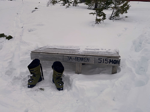Image #9: At 515 m.a.m.s.l., there is a bench, well suited to sit down and change from ordinary touring boots to ski touring boots, and maybe even to have a little to eat before you put your skis on and continue up the mountainside.