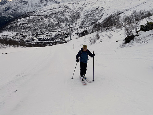 Image #4: My son on his way upward, with the cabin/cottage village at Strandafjellet Skiing Centre visible behind him.