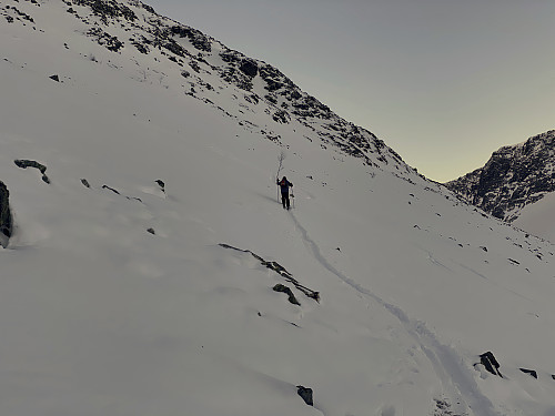Image #6: As we were climbing from Gjølbotnen hanging valley up the west ridge of Mount Hesten, the ski trails that we were following, became gradually steeper, as did the mountain side in general.