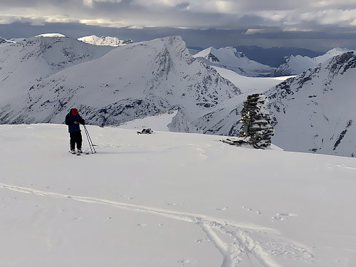 Image #10: At the summit of Mount Hesten [1610 m.a.m.s.l.]. In the background its seen the northwest peak of the mountain [1481 m.a.m.s.l.], and behind that peak is seen Mount Nonstinden.