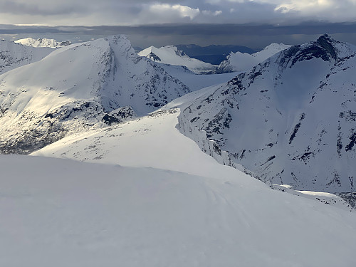 Image #14: On our way back down from Mount Hesten. In the middle is seen the northwest peak of the mountain, and behind it is seen (to the left) Mount Nonstinden [1573 m.a.m.s.l.] and (to the right) Mount Middagstinden [1569 ma.m.s.l.].