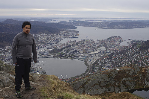 Image #5: Admiring the city of Bergen from the west peak of Mount Ulriken. Beyond the city, some islands are seen, and beyond them, is the Atlantic Ocean.