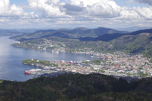 Image #1: Halfway up the mountainside of Mount Løvstakken. In the background are seen the fjord and the city of Bergen, and just in front of the city the knolls called Liafjellet [286 m.a.m.s.l.] and Strandafjellet [294 m.a.m.s.l.].