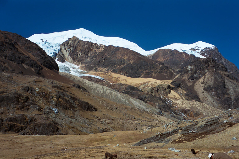 View of Illimani and the normal route up the ridge, seen from base camp at Puente Roto