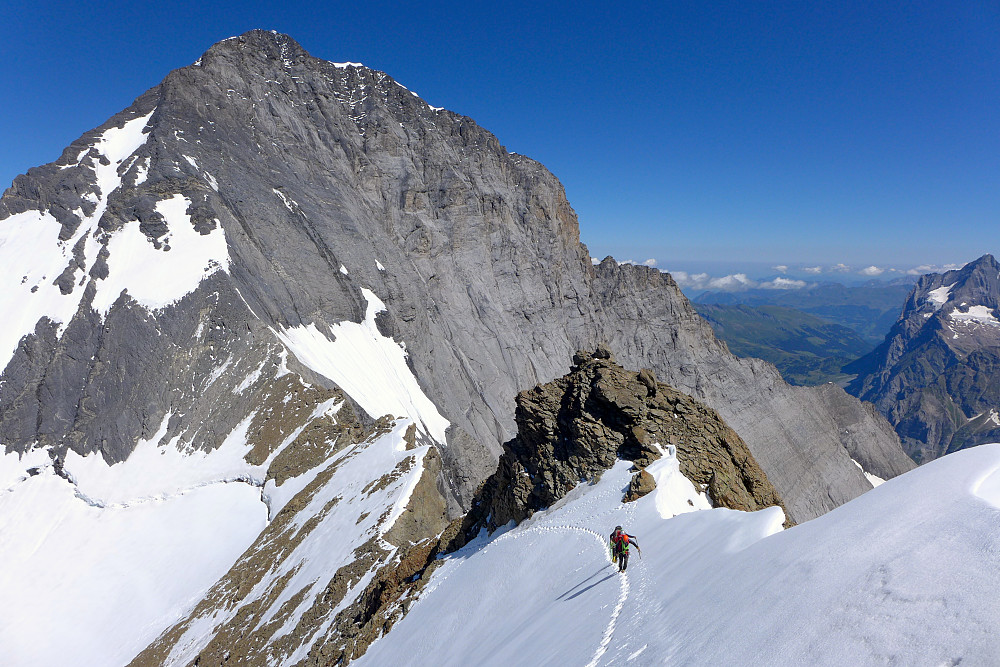 A look back along the south ridge up to the summit of the Eiger