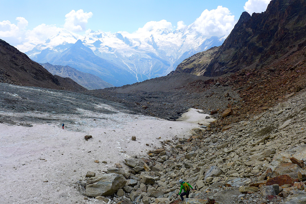 Walking back down the glacier after the descent from the ridge