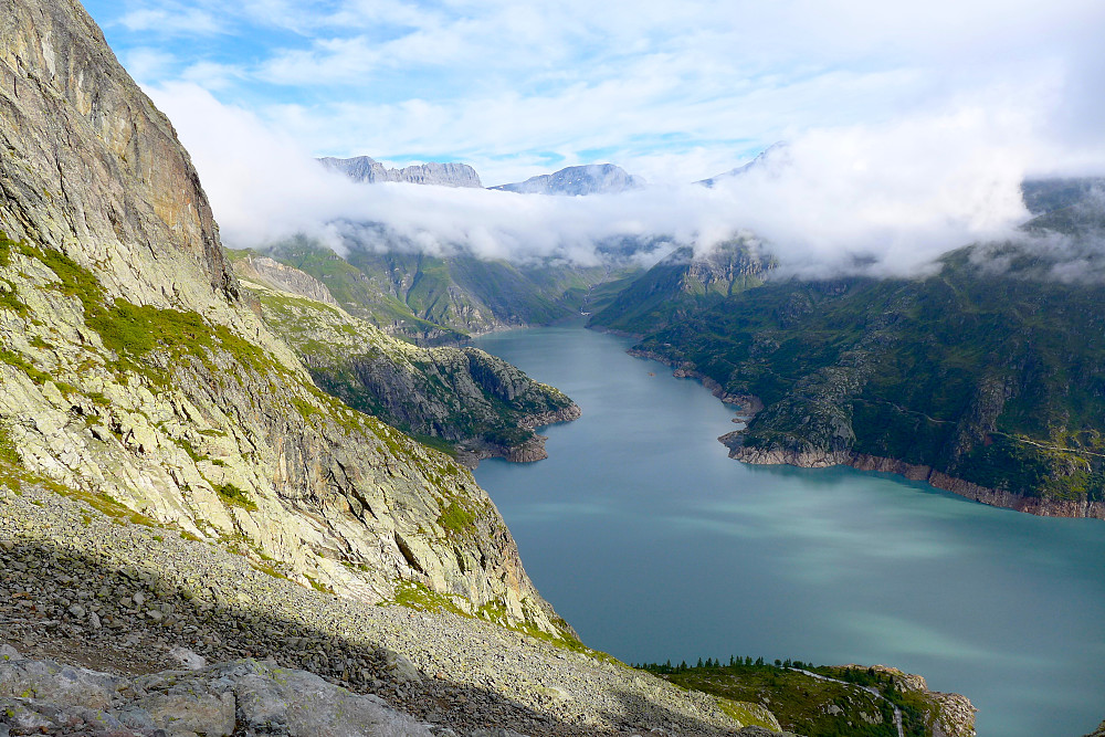 Lac d'emosson emerges from the fog