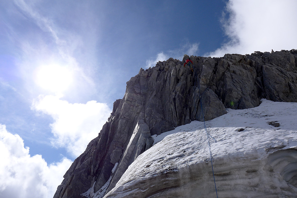 Sami abseiling down to the snow