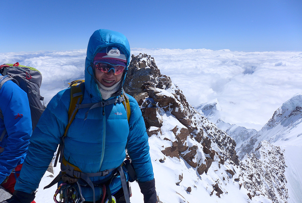 Me at the top of the Dufourspitze with many, many jackets on! :)