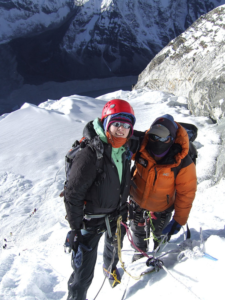 Gelu and me on the head wall, part way up the fixed ines. By this time we were sheltered enough from the wind to actually enjoy a photo stop!