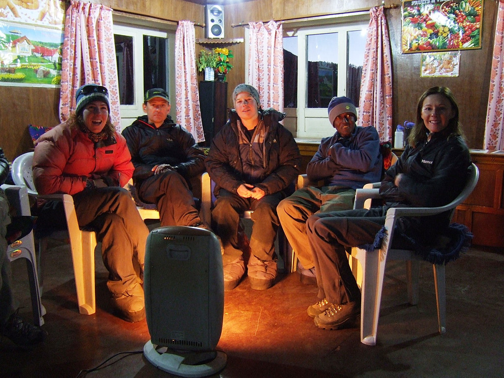 Cio, Dave, Alys, Syam and Bev (left to right) enjoying cosy times around an electric heater! 