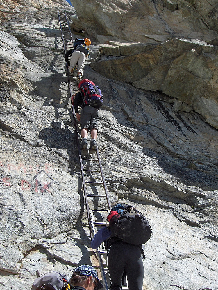 Descending the ladders down to the Dix glacier