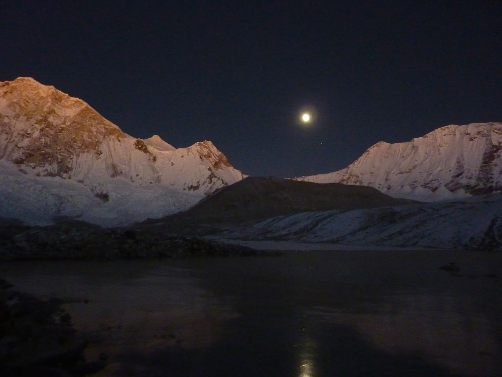 Ca. 15 hours after getting up for the summit day. A full moon lights up the mountain.